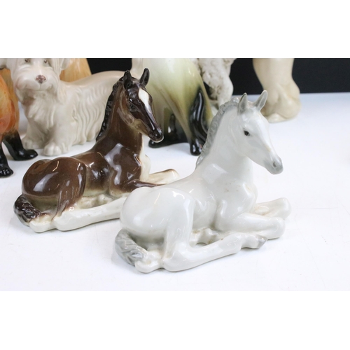 34 - Assortment of ceramic animal figurines, to include Sylvac sausage dog, Sad Sam spaniel and Terrier 1... 