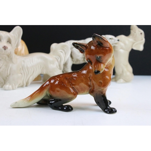 34 - Assortment of ceramic animal figurines, to include Sylvac sausage dog, Sad Sam spaniel and Terrier 1... 