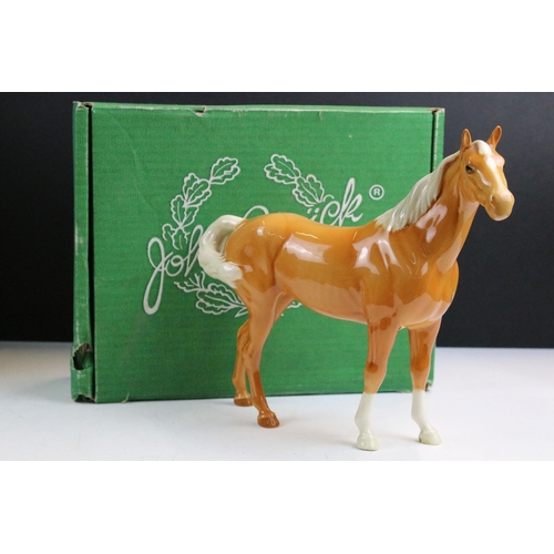 36 - Collection of four Beswick horses to include New Forest Pony, dapple grey standing Shire horse and s... 