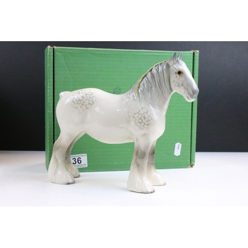 36 - Collection of four Beswick horses to include New Forest Pony, dapple grey standing Shire horse and s... 