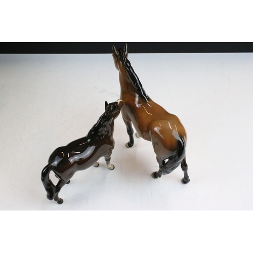 36 - Collection of four Beswick horses to include New Forest Pony, dapple grey standing Shire horse and s... 