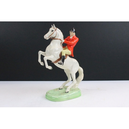 38 - Group of Beswick horses to include three small high gloss brown pony examples together with a Beswic... 