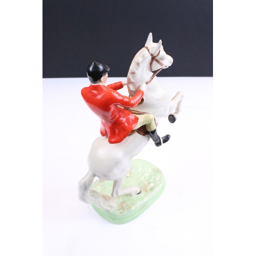 38 - Group of Beswick horses to include three small high gloss brown pony examples together with a Beswic... 