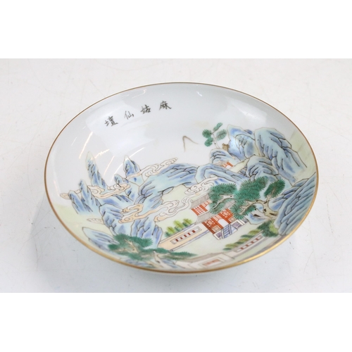 43 - 19th Century Chinese cup and saucer each being enamelled with mountainous pagoda scenes in red, gree... 