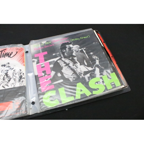 1028 - Vinyl - 18 The Clash 7” singles spanning their career including foreign pressings in folder, to incl... 