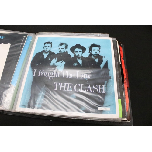 1028 - Vinyl - 18 The Clash 7” singles spanning their career including foreign pressings in folder, to incl... 