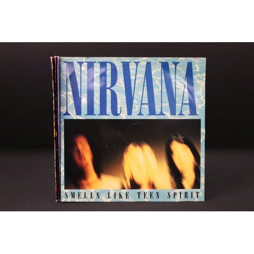 325 - Vinyl - 4 Nirvana UK pressing 7” singles to include: Smells Like Teen Spirit (DGCS 5), Come As You A... 