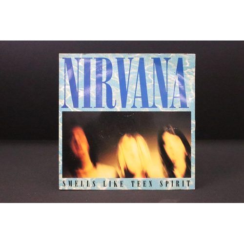 325 - Vinyl - 4 Nirvana UK pressing 7” singles to include: Smells Like Teen Spirit (DGCS 5), Come As You A... 