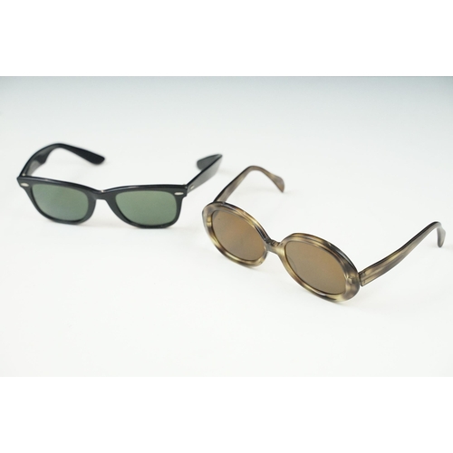 264 - Two pairs of vintage sunglasses to include Rayban and Metzler examples.