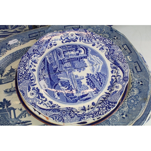 29 - Selection of large meat platter plates, to include Willow pattern Ironstone designs, pagoda scene, b... 