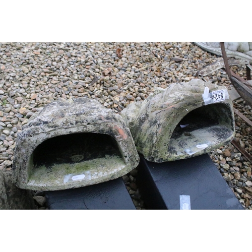 542 - Pair of cast concrete wall pocket planters in the form of classical masks. Measures 43cm tall.