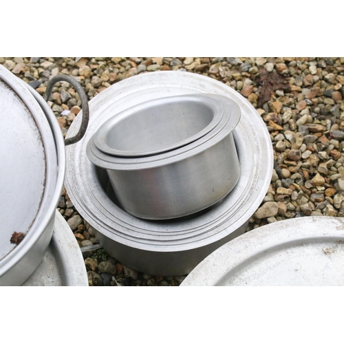 546 - Group of aluminium bowls in graduating sizes, one with handles and lid along with two other lidded e... 