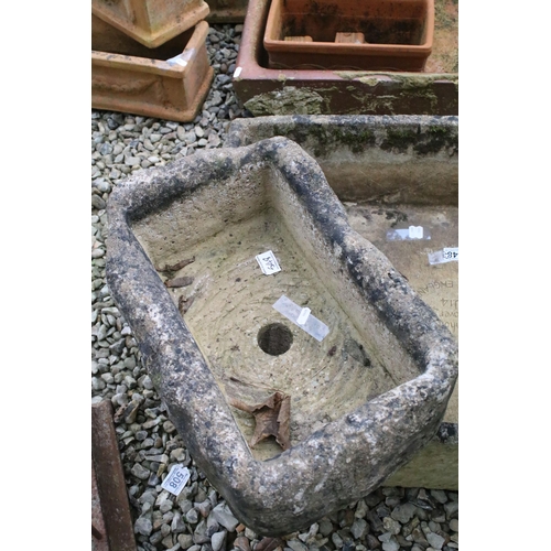 548 - Cotswold Stone 'Man Hole Cover' U14 reconstitutes tone planter of rectangular form together with two... 