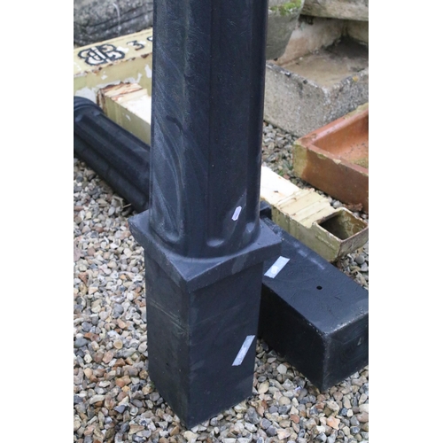 551 - Pair of cast plastic bollards with reeded columns. Measures approx 135cm tall.