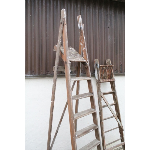 553 - Two sets of tall folding step ladders