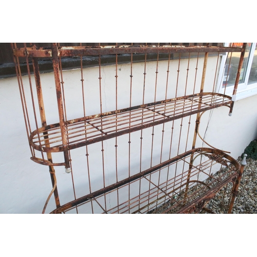 556 - Victorian garden plant shelf unit having five slatted shelves with scrolled foliate details. Measure... 