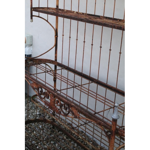 556 - Victorian garden plant shelf unit having five slatted shelves with scrolled foliate details. Measure... 