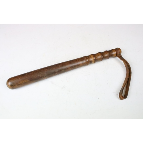 139 - Wooden truncheon with leather strap c. WWII, length 37cm