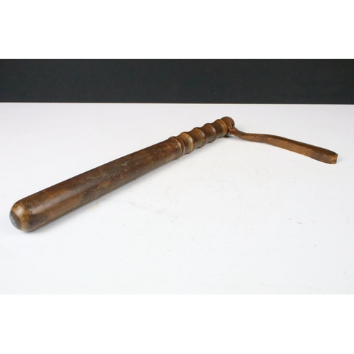 139 - Wooden truncheon with leather strap c. WWII, length 37cm