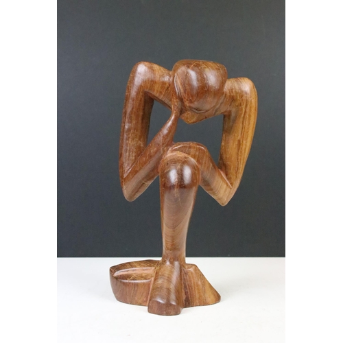 145 - Carved wooden figure abstract sculpture of 'thinker' H 28cm together with a hand carved Well's wizar... 