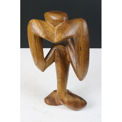 145 - Carved wooden figure abstract sculpture of 'thinker' H 28cm together with a hand carved Well's wizar... 