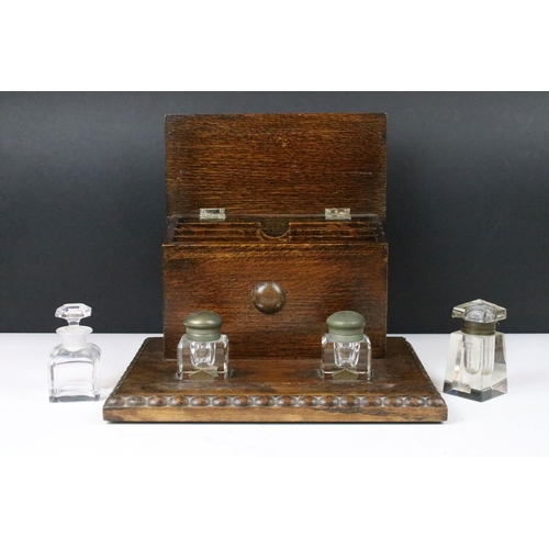 155 - 20th century carved beaded edge wooden lidded desk tidy with glass ink wells, four letter partitions... 