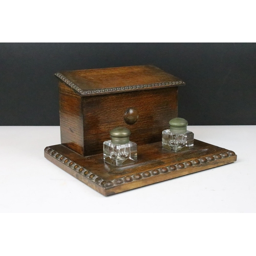 155 - 20th century carved beaded edge wooden lidded desk tidy with glass ink wells, four letter partitions... 