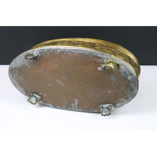 158 - Brass oval planter with relief swan surround decoration, raised on three brass paw feet (one paw pre... 