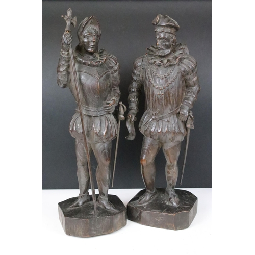 163 - Pair of wooden Renaissance Tudor style hand carved figures on square plinths, both signed Allegrain ... 