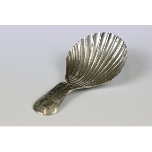 182 - George III silver caddy spoon with bright cut engraved handle and fluted bowl, Birmingham 1803, make... 