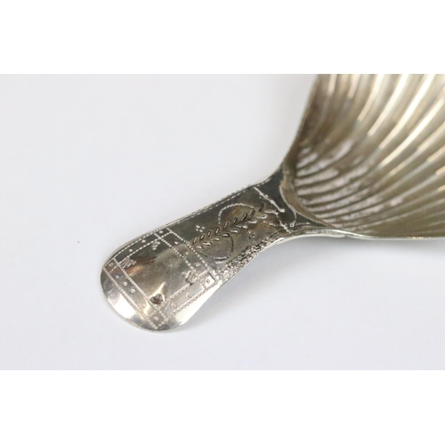 182 - George III silver caddy spoon with bright cut engraved handle and fluted bowl, Birmingham 1803, make... 