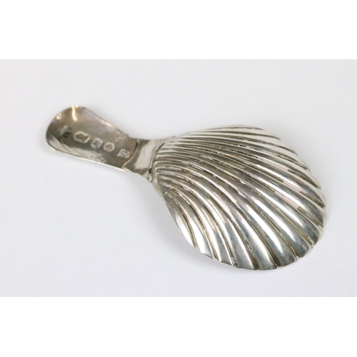 182 - George III silver caddy spoon with bright cut engraved handle and fluted bowl, Birmingham 1803, make... 