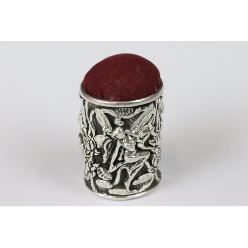 183 - Highly decorated silver pincushion depicting winged nymphs