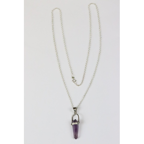 184 - Silver and amethyst polished crystal pendant, 5cm long held on long silver necklace chain