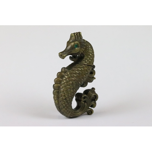 188 - Brass cased vesta in the form of a sea horse with emerald coloured eyes