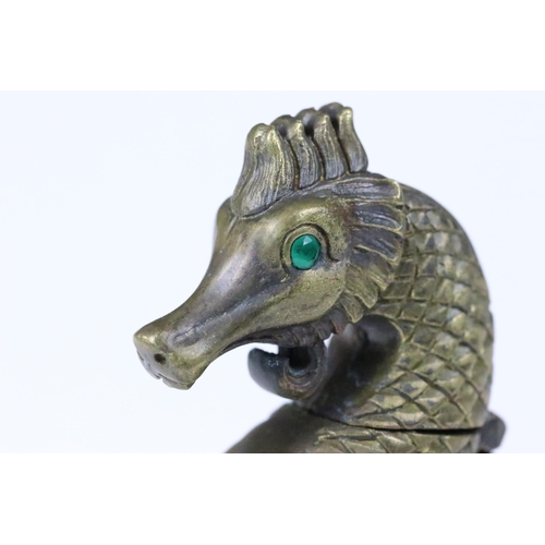 188 - Brass cased vesta in the form of a sea horse with emerald coloured eyes