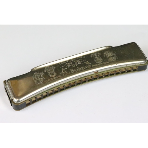 191 - Eight harmonicas including cased Hohner ‘ The Super Chromonic ‘,  cased Hohner Chrometta, cased Vict... 