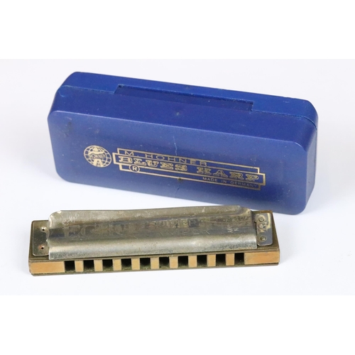 191 - Eight harmonicas including cased Hohner ‘ The Super Chromonic ‘,  cased Hohner Chrometta, cased Vict... 