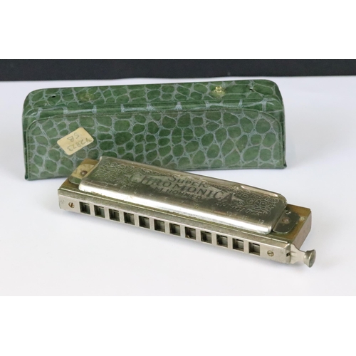 191 - Eight harmonicas including cased Hohner ‘ The Super Chromonic ‘,  cased Hohner Chrometta, cased Vict... 