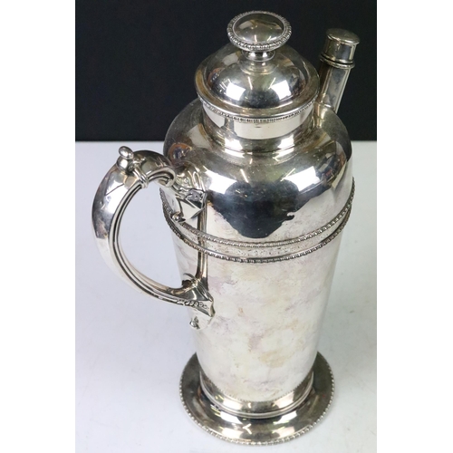 198 - An early 20th century silver plated art deco cocktail shaker together with with a plated photograph ... 