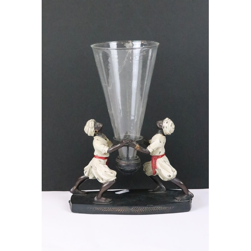 215 - A colonial style Blackamore ornamental table centrepiece with conical glass vase.