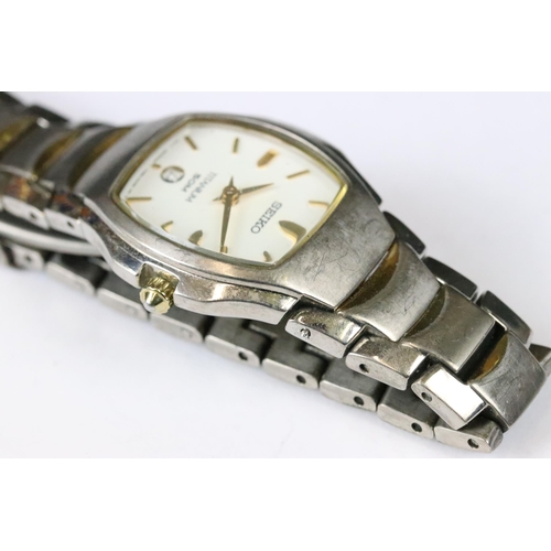 219 - A small collection of three ladies wristwatches to include a Seiko Titanium example.