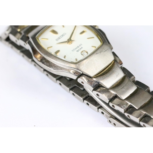 219 - A small collection of three ladies wristwatches to include a Seiko Titanium example.