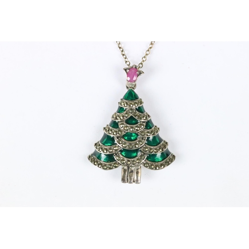 223 - A contemporary 925 sterling silver pendant in the form of a Christmas tree on a sterling silver neck... 