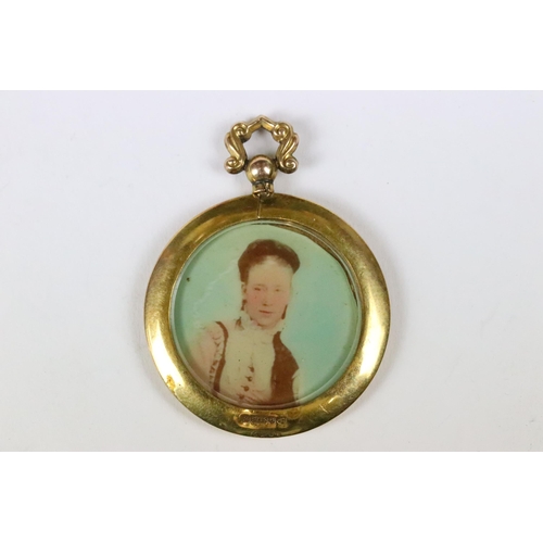 230 - A 9ct gold framed miniature double sided locket with hand painted portraits of a male and female, ap... 