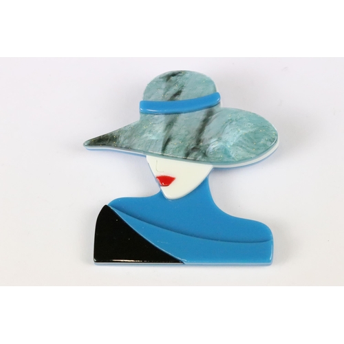 231 - An Art Nouveau lady with hat brooch in the style of Lea Stein.