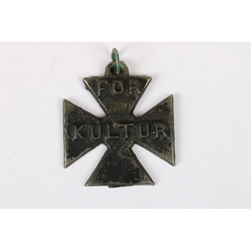 258 - A British World War One propaganda medal 'For Kultur' in the form of an iron cross.