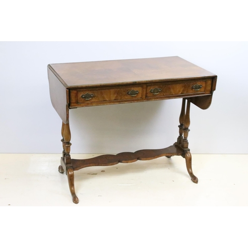 569 - 20th century mahogany sofa table with two drop leaves above two drawers on turned supports, 72.5cm h... 