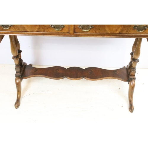 569 - 20th century mahogany sofa table with two drop leaves above two drawers on turned supports, 72.5cm h... 