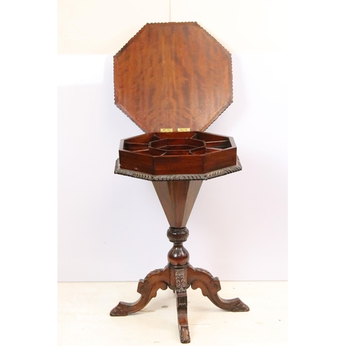 572 - Mahogany sewing box having an octagonal top opening to reveal a compartmentalised interior raised on... 